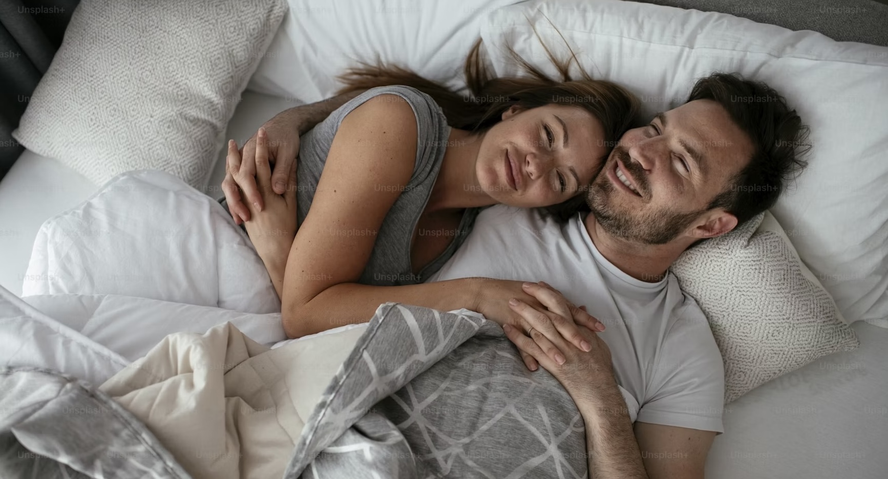 A couple resting after reviewing their monthly budget together at home, illustrating financial wellness, money management, and peace of mind.