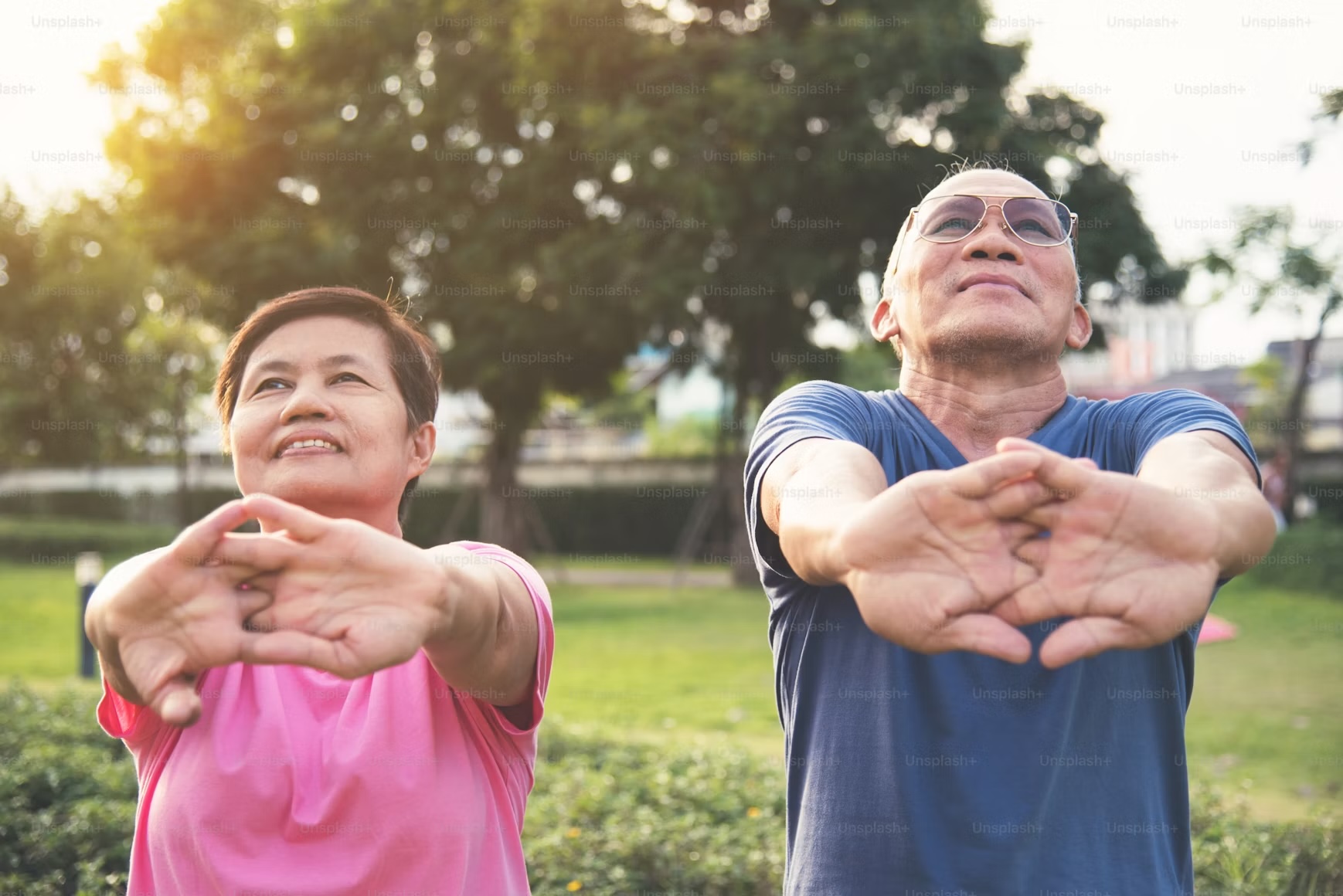 Filipino couple exercising together outdoors, representing healthy aging and longevity