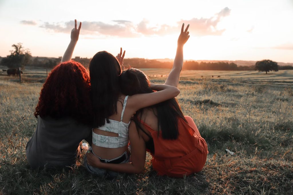 Friends sharing a happy conversation, reflecting the value of meaningful connections as people grow and change.
