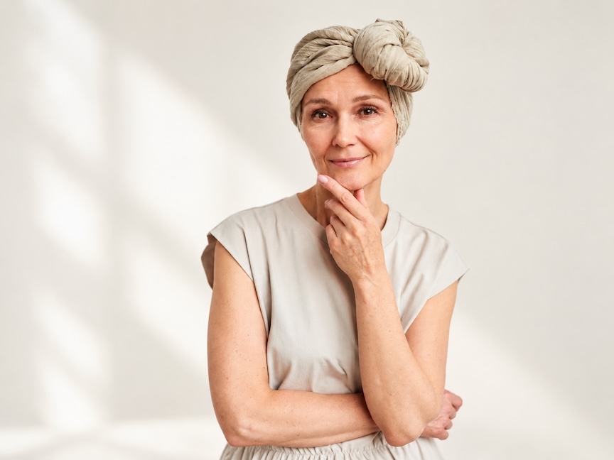 Woman wearing a soft headscarf as part of self-care during chemotherapy.