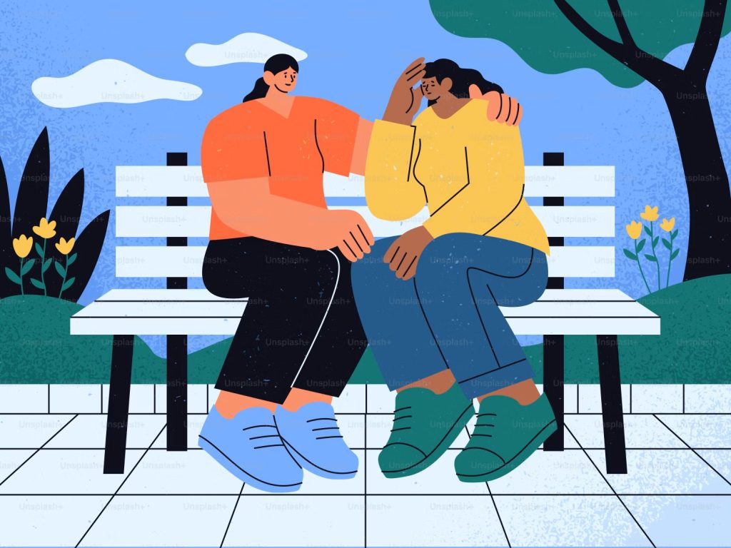 Two people sharing a supportive conversation about mental health and emotional well-being.